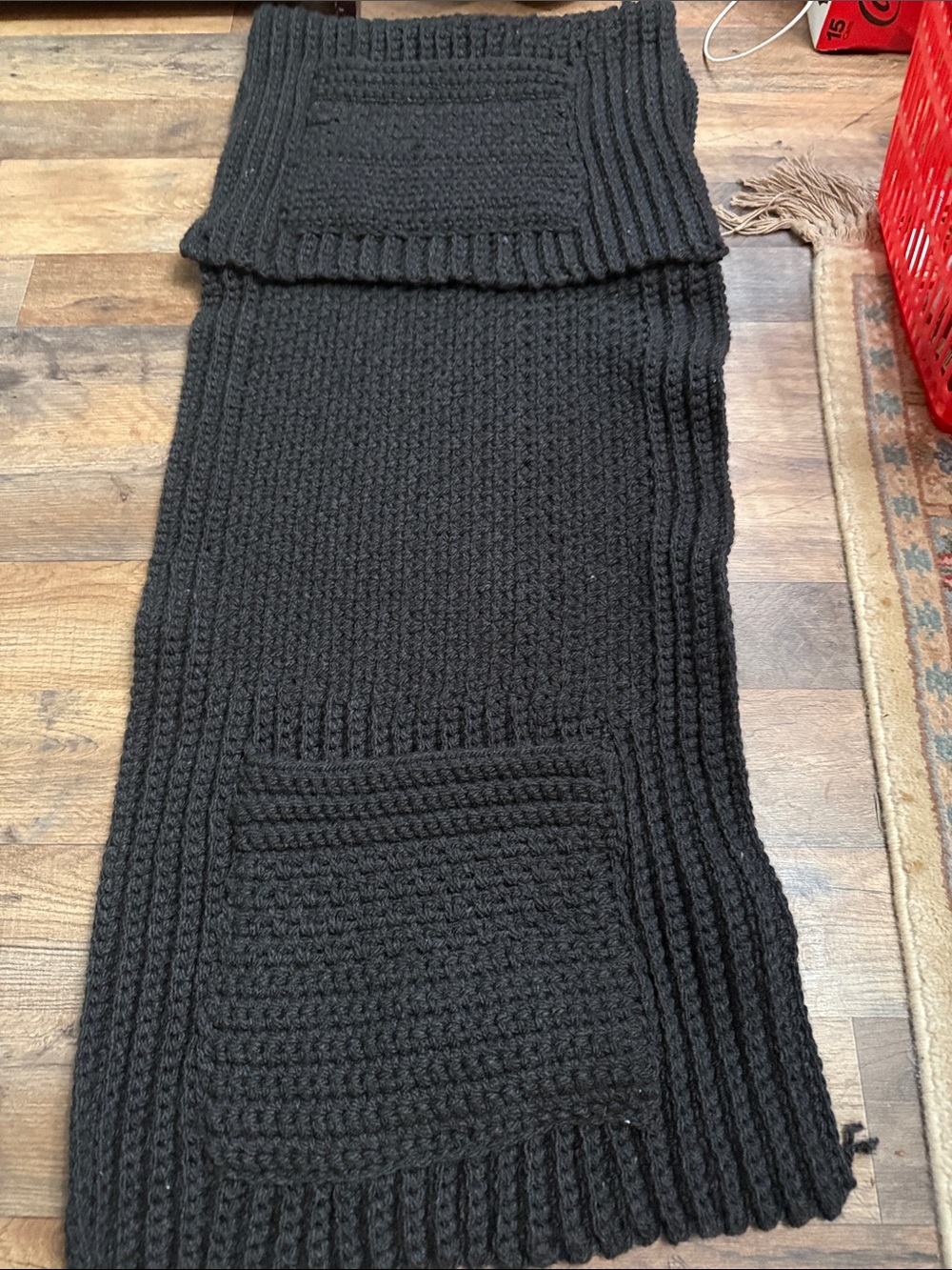 Artisan Black Ribbed Knit Throw Blanketwith pockets for storing things on couch